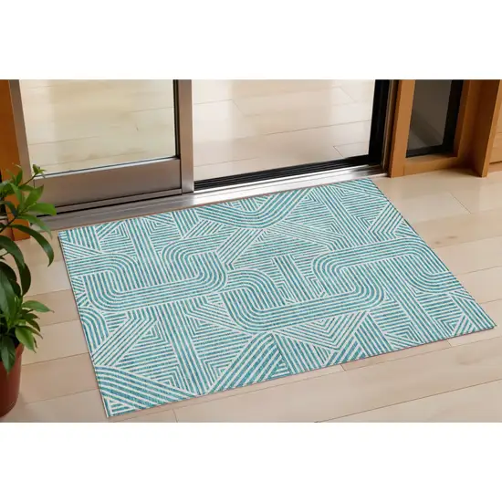 Teal Blue And Ivory Abstract Washable Indoor Outdoor Area Rug Photo 1