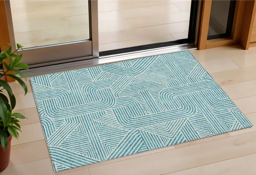 Teal Blue And Ivory Abstract Washable Indoor Outdoor Area Rug Photo 1