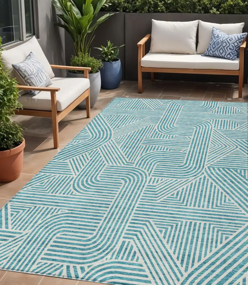 Teal Blue And Ivory Abstract Washable Indoor Outdoor Area Rug Photo 1