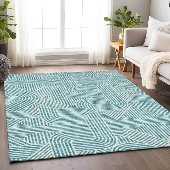 Teal Blue And Ivory Abstract Washable Indoor Outdoor Area Rug Photo 9