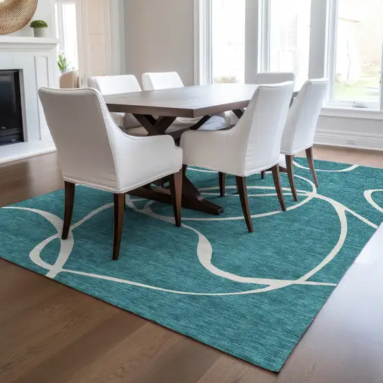 Teal Blue And Ivory Abstract Washable Indoor Outdoor Area Rug Photo 9
