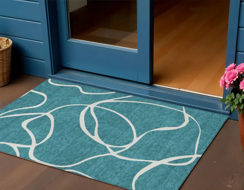 Teal Blue And Ivory Abstract Washable Indoor Outdoor Area Rug Photo 1