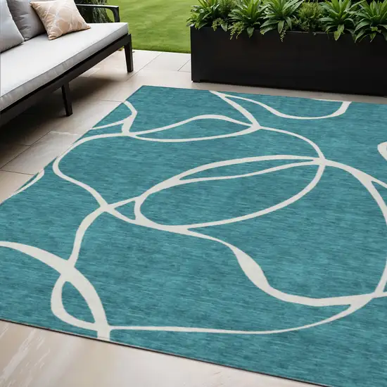 Teal Blue And Ivory Abstract Washable Indoor Outdoor Area Rug Photo 1