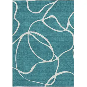Photo of Teal Blue And Ivory Abstract Washable Indoor Outdoor Area Rug