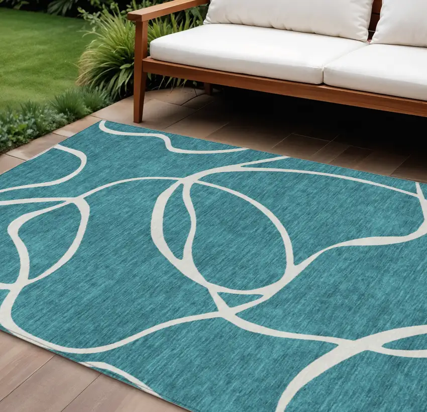 Teal Blue And Ivory Abstract Washable Indoor Outdoor Area Rug Photo 1