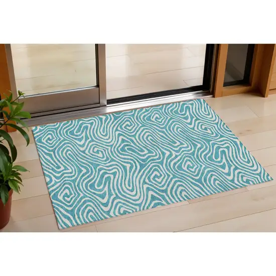 Teal Blue And Ivory Abstract Washable Indoor Outdoor Area Rug Photo 1