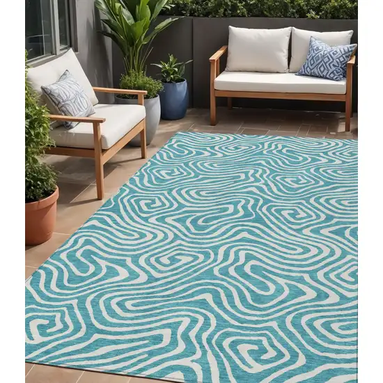 Teal Blue And Ivory Abstract Washable Indoor Outdoor Area Rug Photo 1