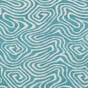 Photo of Teal Blue And Ivory Abstract Washable Indoor Outdoor Area Rug