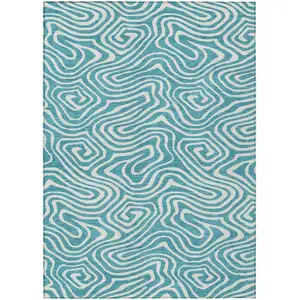 Photo of Teal Blue And Ivory Abstract Washable Indoor Outdoor Area Rug