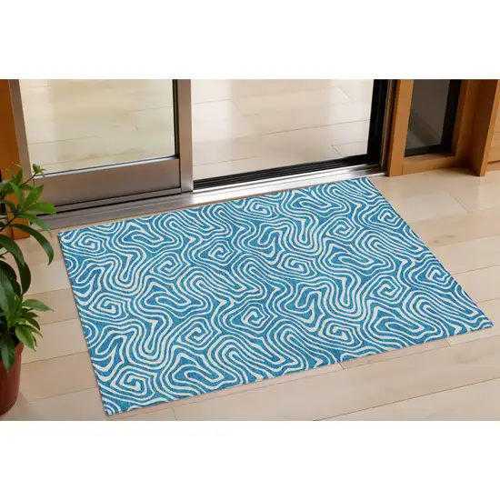 Teal Blue And Ivory Abstract Washable Indoor Outdoor Area Rug Photo 1