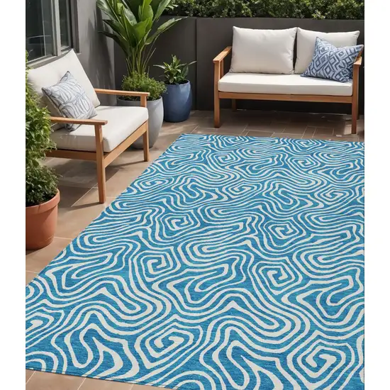 Teal Blue And Ivory Abstract Washable Indoor Outdoor Area Rug Photo 1