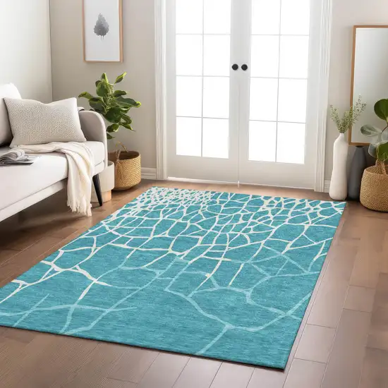 Teal Blue And Ivory Abstract Washable Indoor Outdoor Area Rug Photo 9