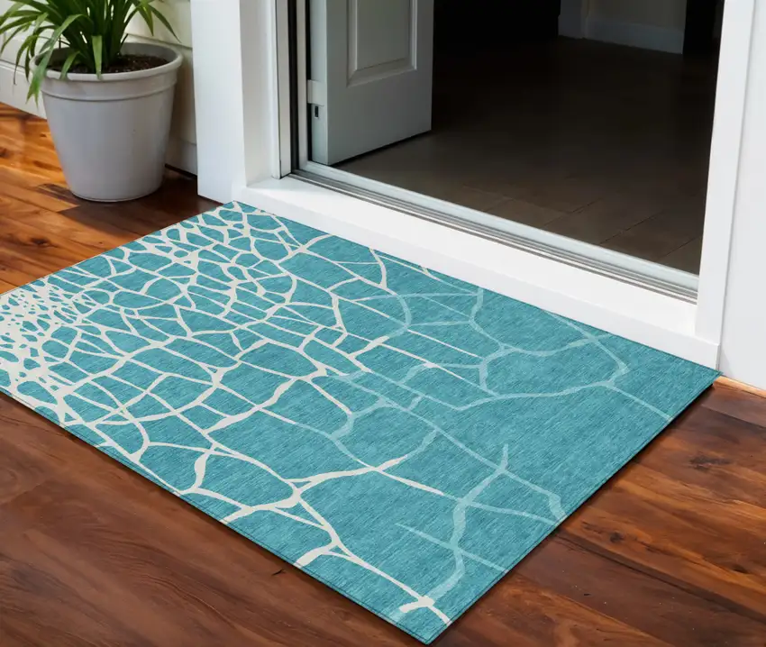 Teal Blue And Ivory Abstract Washable Indoor Outdoor Area Rug Photo 1