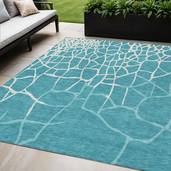 Teal Blue And Ivory Abstract Washable Indoor Outdoor Area Rug Photo 1