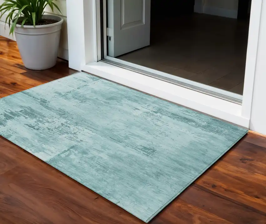 Teal Blue And Ivory Abstract Washable Indoor Outdoor Area Rug Photo 1