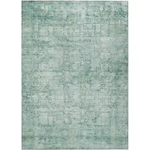 Photo of Teal Blue And Ivory Abstract Washable Indoor Outdoor Area Rug
