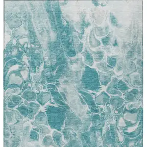 Photo of Teal Blue And Ivory Abstract Washable Indoor Outdoor Area Rug