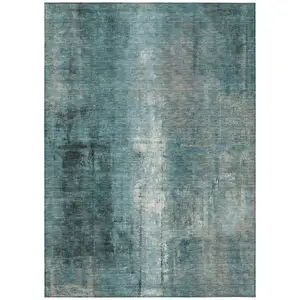 Photo of Teal Blue And Ivory Abstract Washable Indoor Outdoor Area Rug