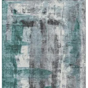 Photo of Teal Blue And Ivory Abstract Washable Indoor Outdoor Area Rug
