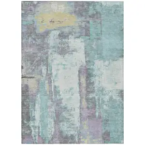 Photo of Teal Blue And Ivory Abstract Washable Indoor Outdoor Area Rug
