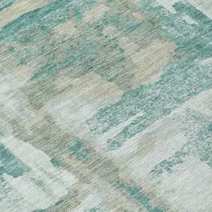Photo of Teal Blue And Ivory Abstract Washable Indoor Outdoor Area Rug