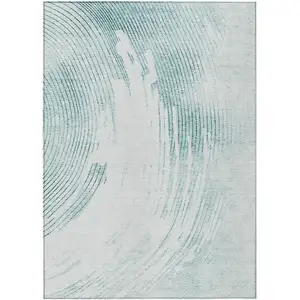 Photo of Teal Blue And Ivory Abstract Washable Indoor Outdoor Area Rug