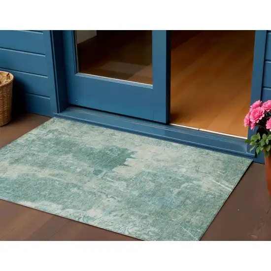 Teal Blue And Ivory Abstract Washable Indoor Outdoor Area Rug Photo 1