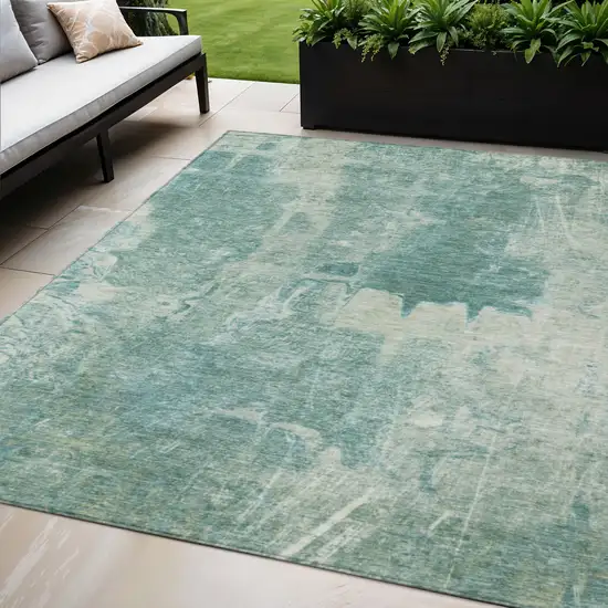 Teal Blue And Ivory Abstract Washable Indoor Outdoor Area Rug Photo 1