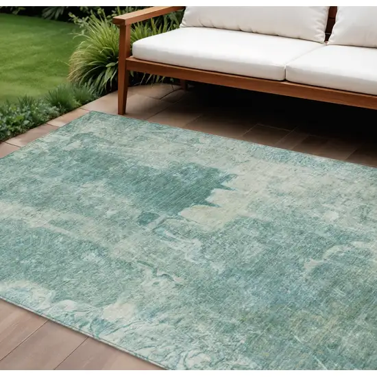 Teal Blue And Ivory Abstract Washable Indoor Outdoor Area Rug Photo 1