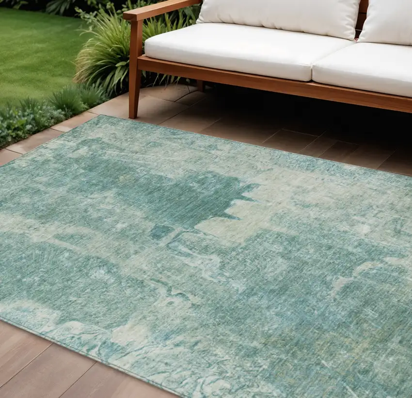 Teal Blue And Ivory Abstract Washable Indoor Outdoor Area Rug Photo 1