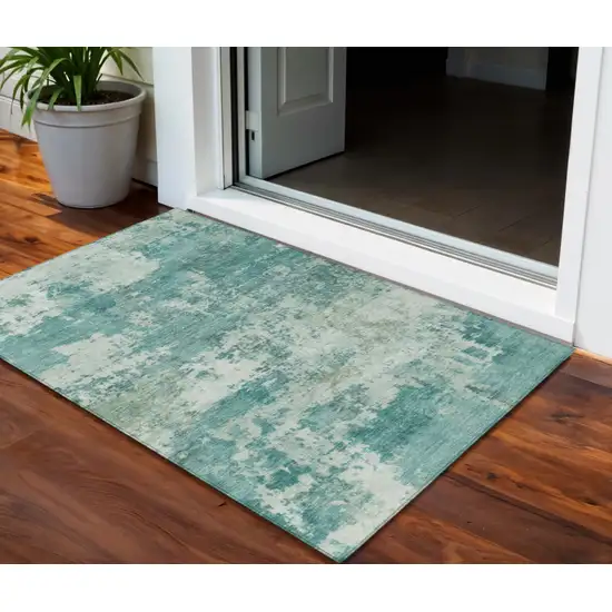 Teal Blue And Ivory Abstract Washable Indoor Outdoor Area Rug Photo 1