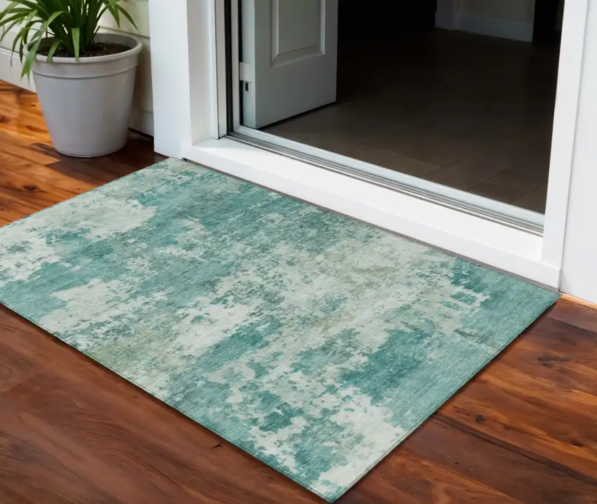 Teal Blue And Ivory Abstract Washable Indoor Outdoor Area Rug Photo 1