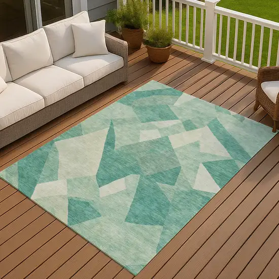 Teal Blue And Ivory Abstract Washable Indoor Outdoor Area Rug Photo 4