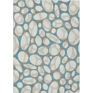 Photo of Teal Blue And Ivory Abstract Washable Indoor Outdoor Area Rug