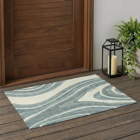 Teal Blue And Ivory Abstract Washable Indoor Outdoor Area Rug Photo 1