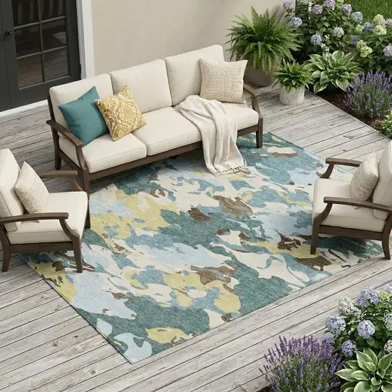 Teal Blue And Ivory Abstract Washable Indoor Outdoor Area Rug Photo 1
