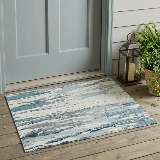Teal Blue And Ivory Abstract Washable Indoor Outdoor Area Rug Photo 1