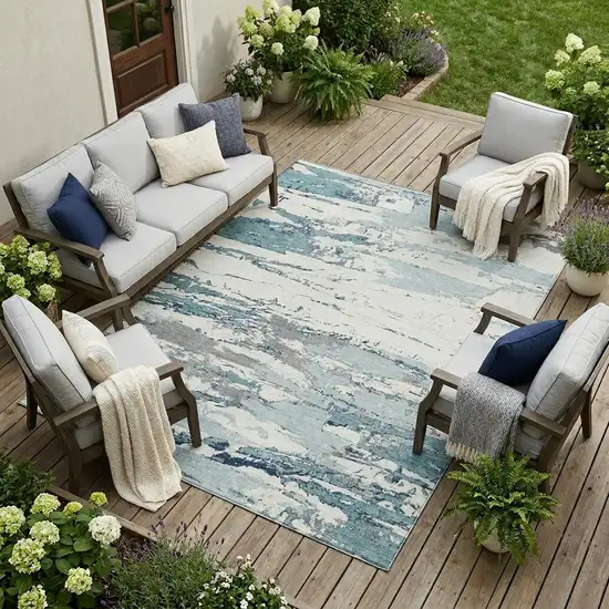 Teal Blue And Ivory Abstract Washable Indoor Outdoor Area Rug Photo 1