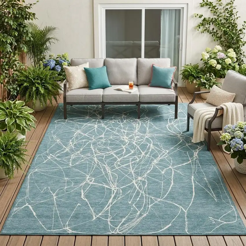 Teal Blue And Ivory Abstract Washable Indoor Outdoor Area Rug Photo 1