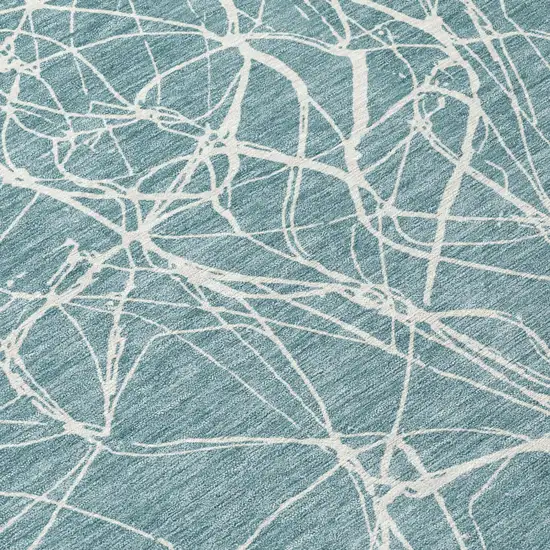 Teal Blue And Ivory Abstract Washable Indoor Outdoor Area Rug Photo 4