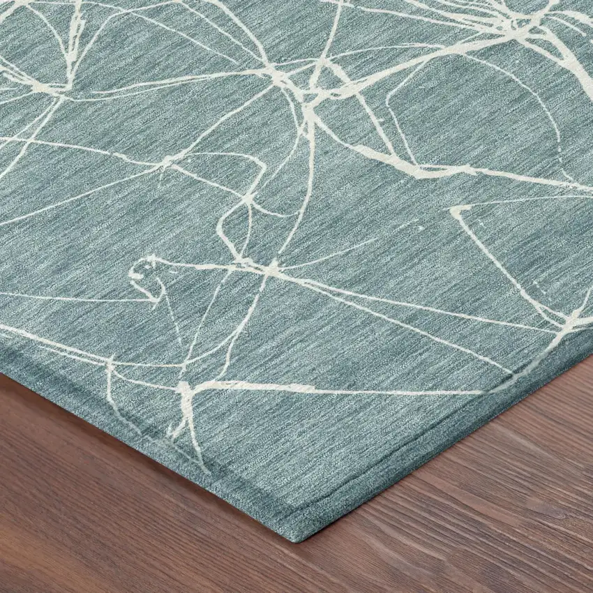 Teal Blue And Ivory Abstract Washable Indoor Outdoor Area Rug Photo 3