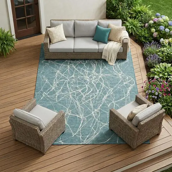 Teal Blue And Ivory Abstract Washable Indoor Outdoor Area Rug Photo 1