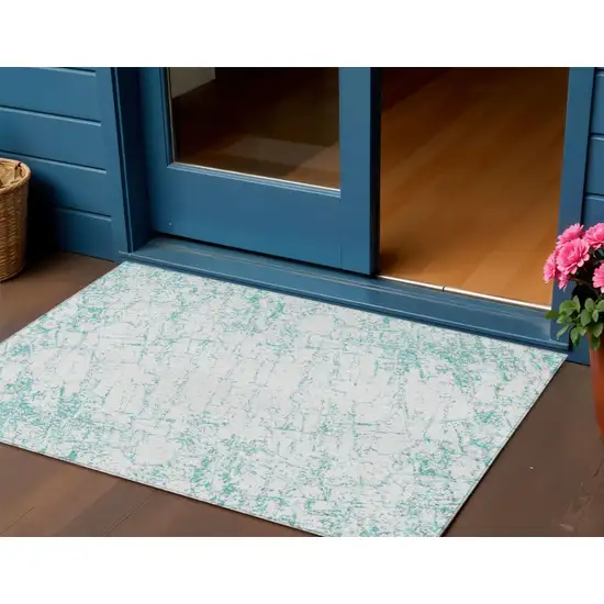 Teal Blue And Ivory Abstract Washable Indoor Outdoor Area Rug Photo 1