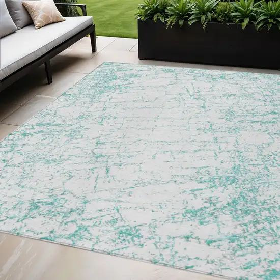 Teal Blue And Ivory Abstract Washable Indoor Outdoor Area Rug Photo 1