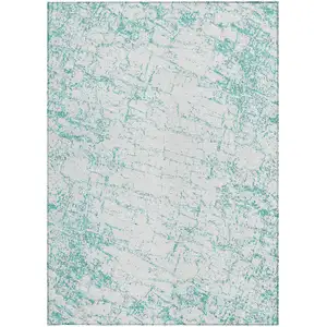 Photo of Teal Blue And Ivory Abstract Washable Indoor Outdoor Area Rug