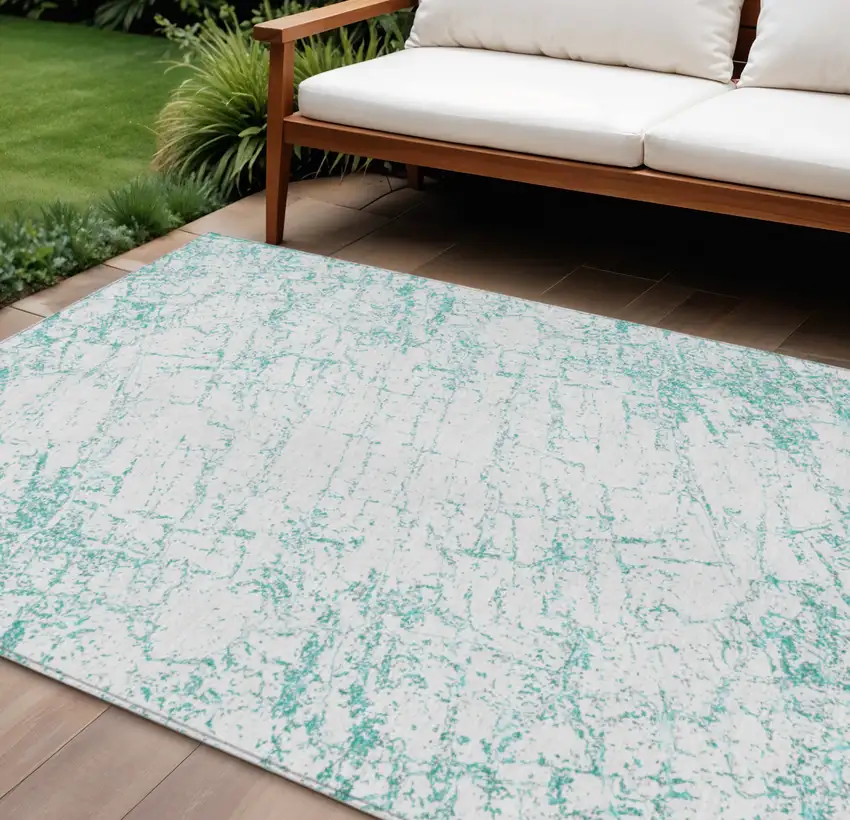 Teal Blue And Ivory Abstract Washable Indoor Outdoor Area Rug Photo 1
