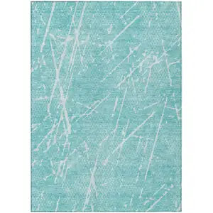 Photo of Teal Blue And Ivory Abstract Washable Indoor Outdoor Area Rug