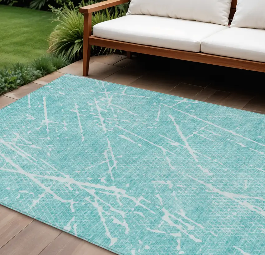 Teal Blue And Ivory Abstract Washable Indoor Outdoor Area Rug Photo 1