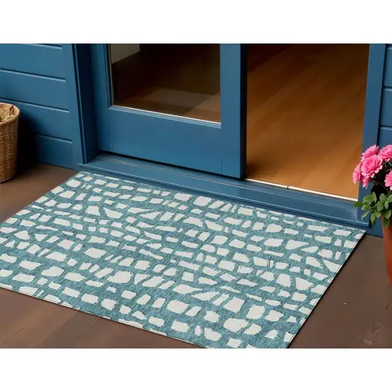 Teal Blue And Ivory Abstract Washable Indoor Outdoor Area Rug Photo 1