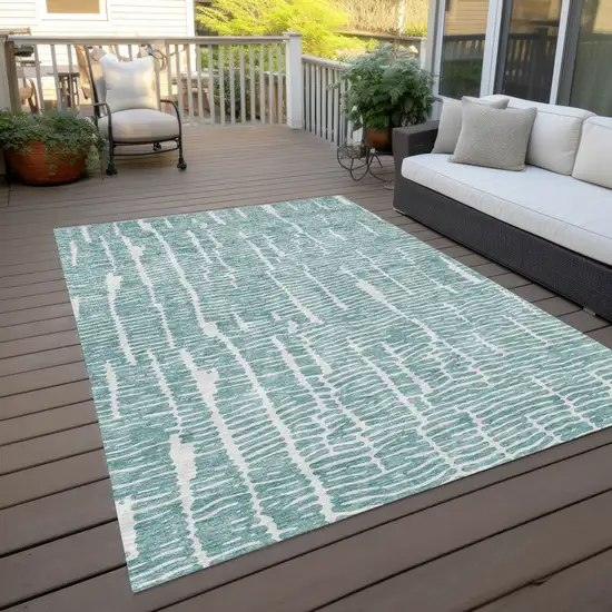 Teal Blue And Ivory Abstract Washable Indoor Outdoor Area Rug Photo 9